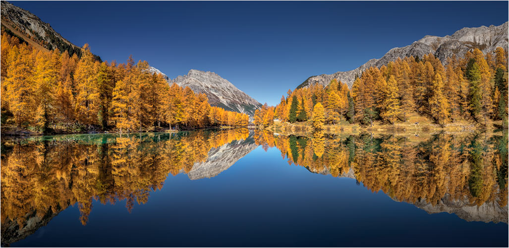 Bergsee Palpuegna mit eine perfekte Seespiegelung